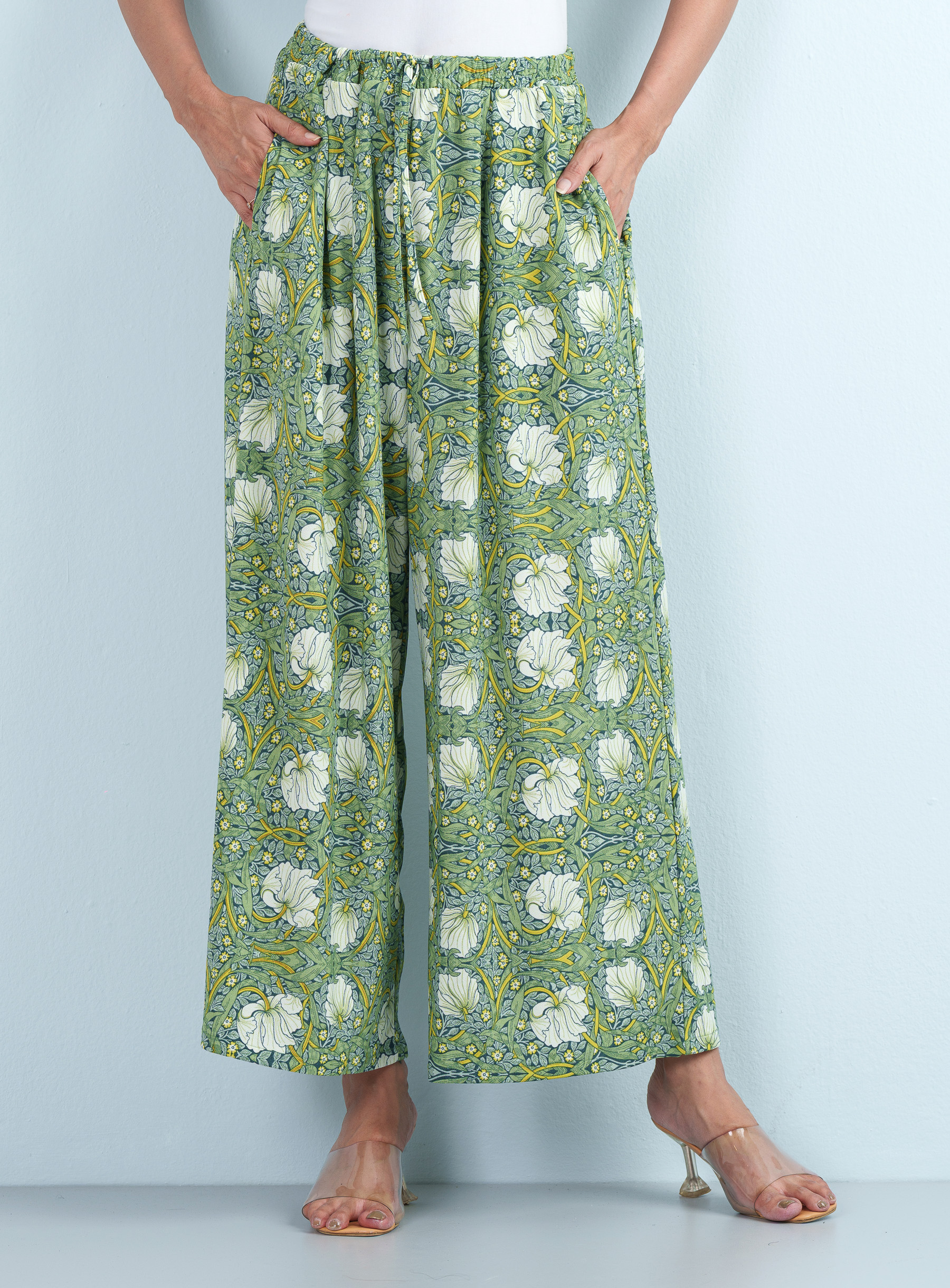 Full front view highlighting the relaxed wide-leg silhouette and elasticated drawstring waist of a patterned green Ladies Palazzo.